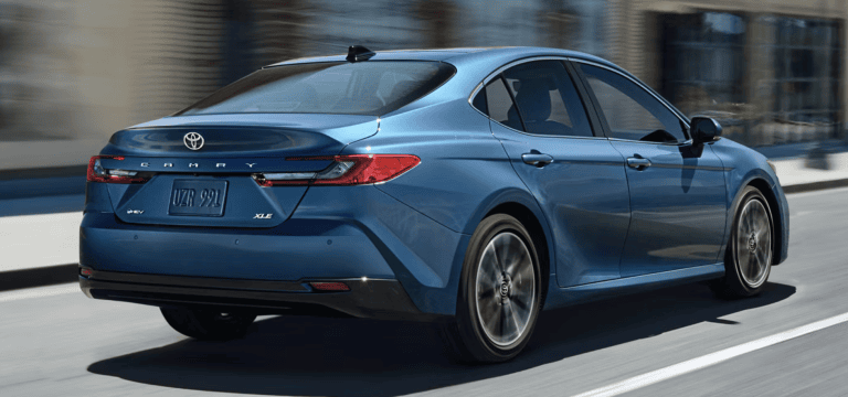 blue 2026 toyota Camry driving in street